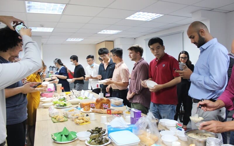 Foreign teachers and Vietnamese staff enjoy a Potluck party